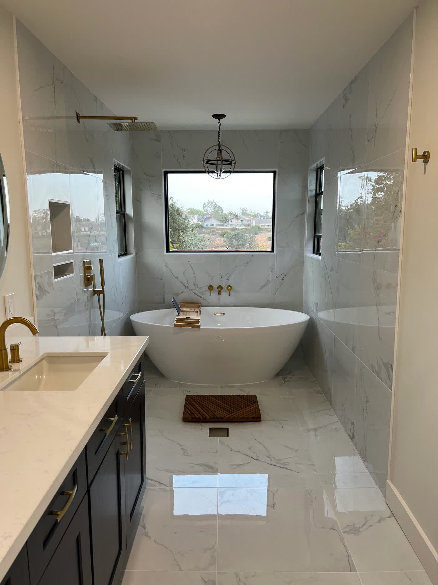 Bathroom renovation with tub by JT Restoration